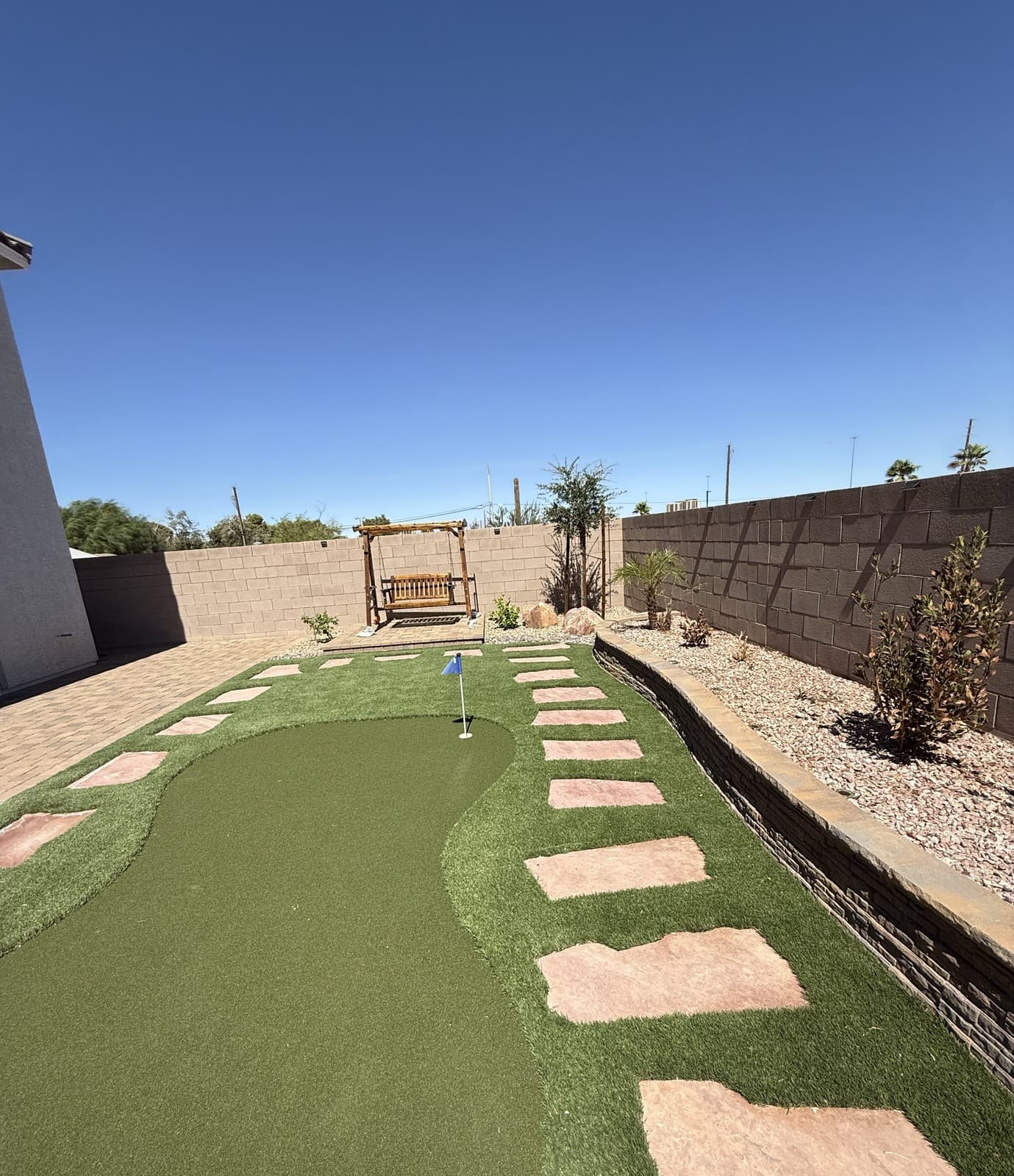 A backyard artificial turf putting green installation, Las Vegas